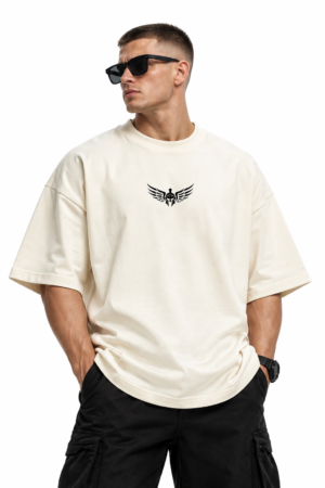 Model wearing an off-white oversized T-shirt with a black winged helmet chest emblem and black cargo trousers.
